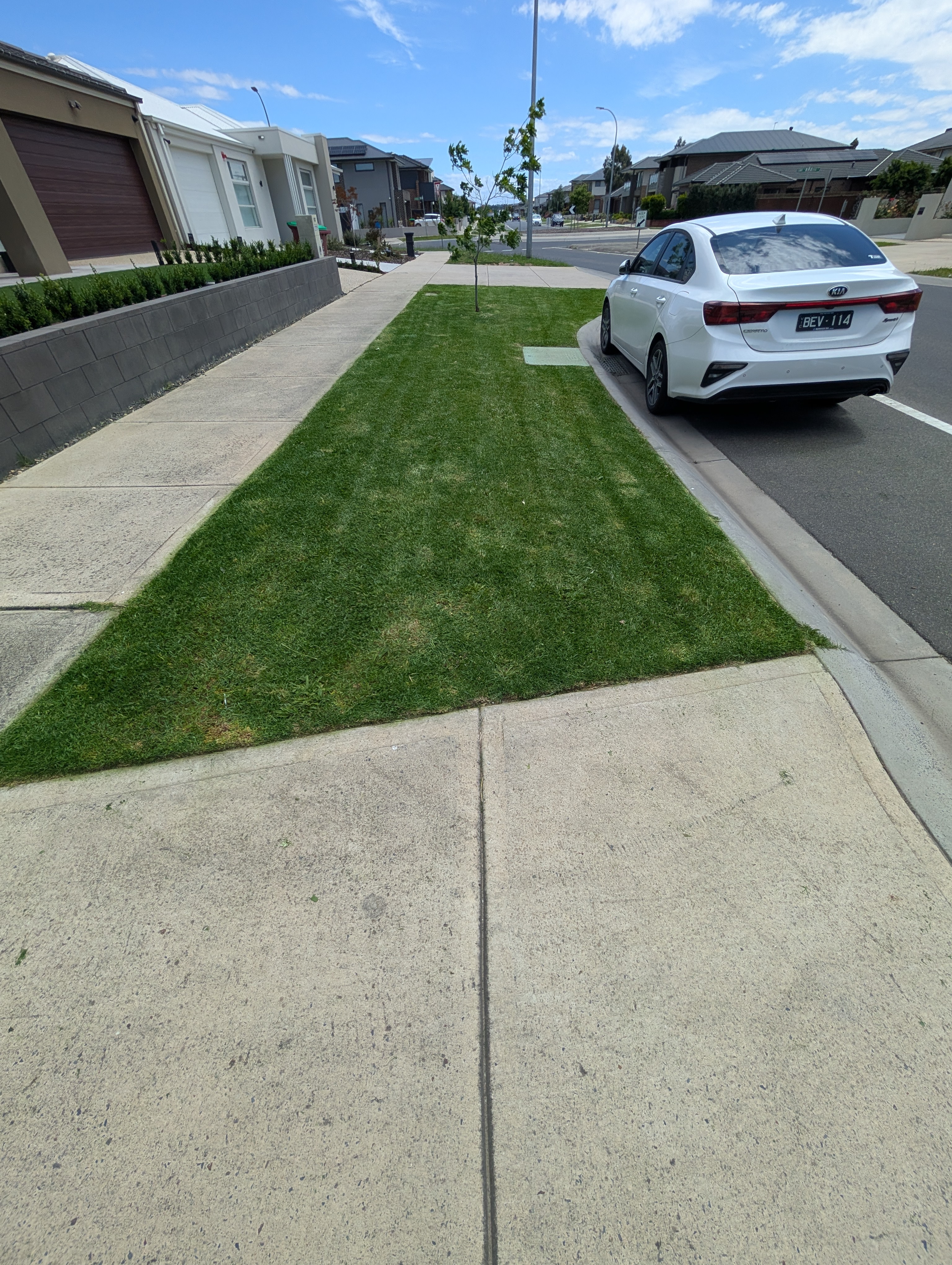 Mowed nature strip with neat residential street finish