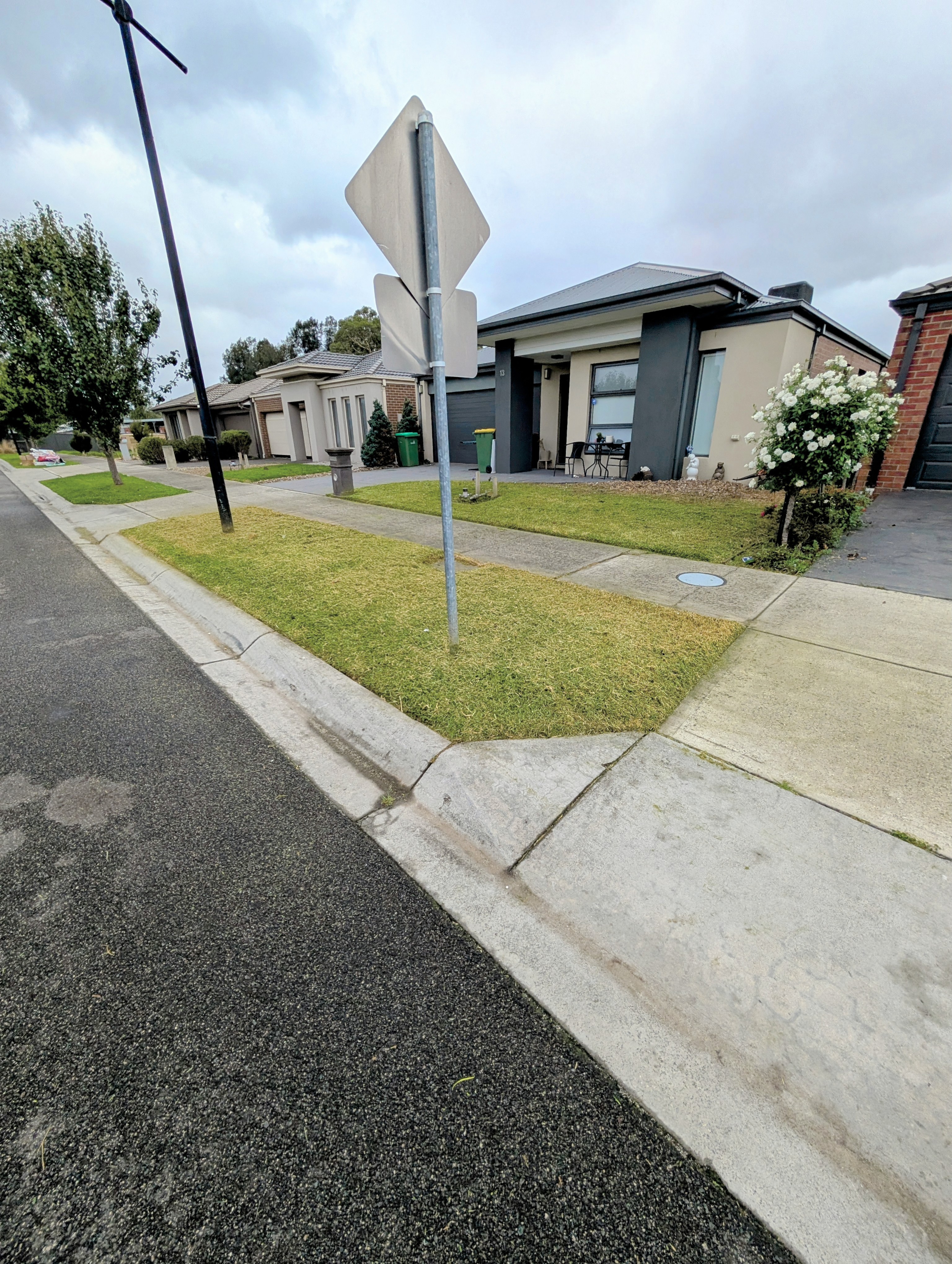 Freshly maintained residential lawn and footpath